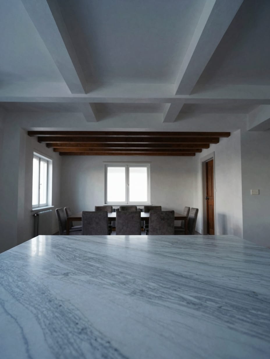 Rustic wooden beams on the ceiling defining a kitchen area in an open home.
